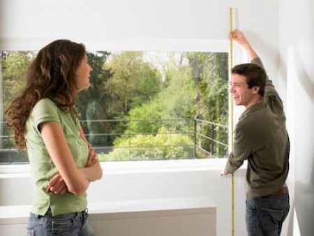 couple-taking-measurement-of-their-home-2024-11-03-03-23-45-utc (1).jpg